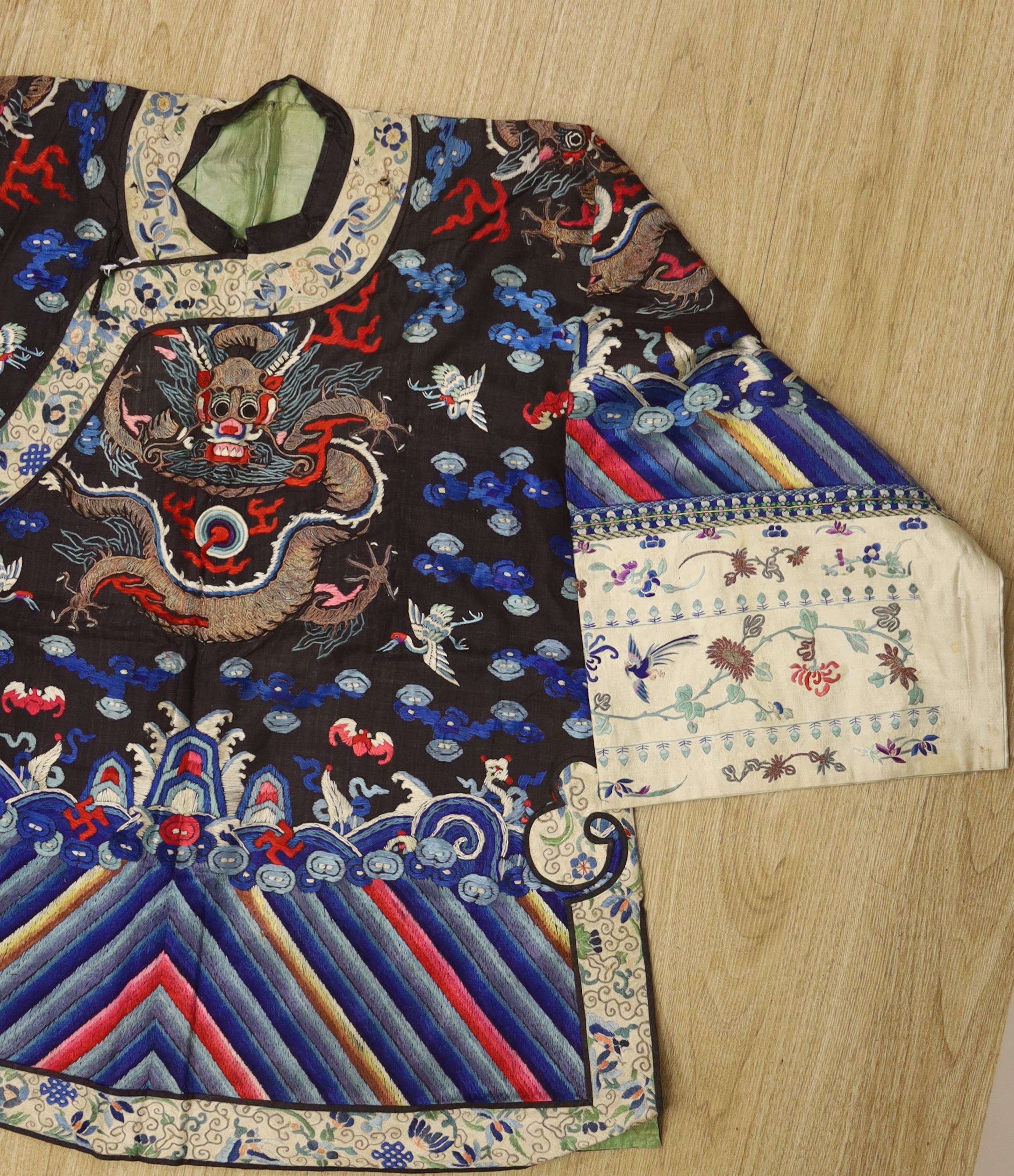 An early 20th century Chinese dragon embroidered silk robe, length 71cm